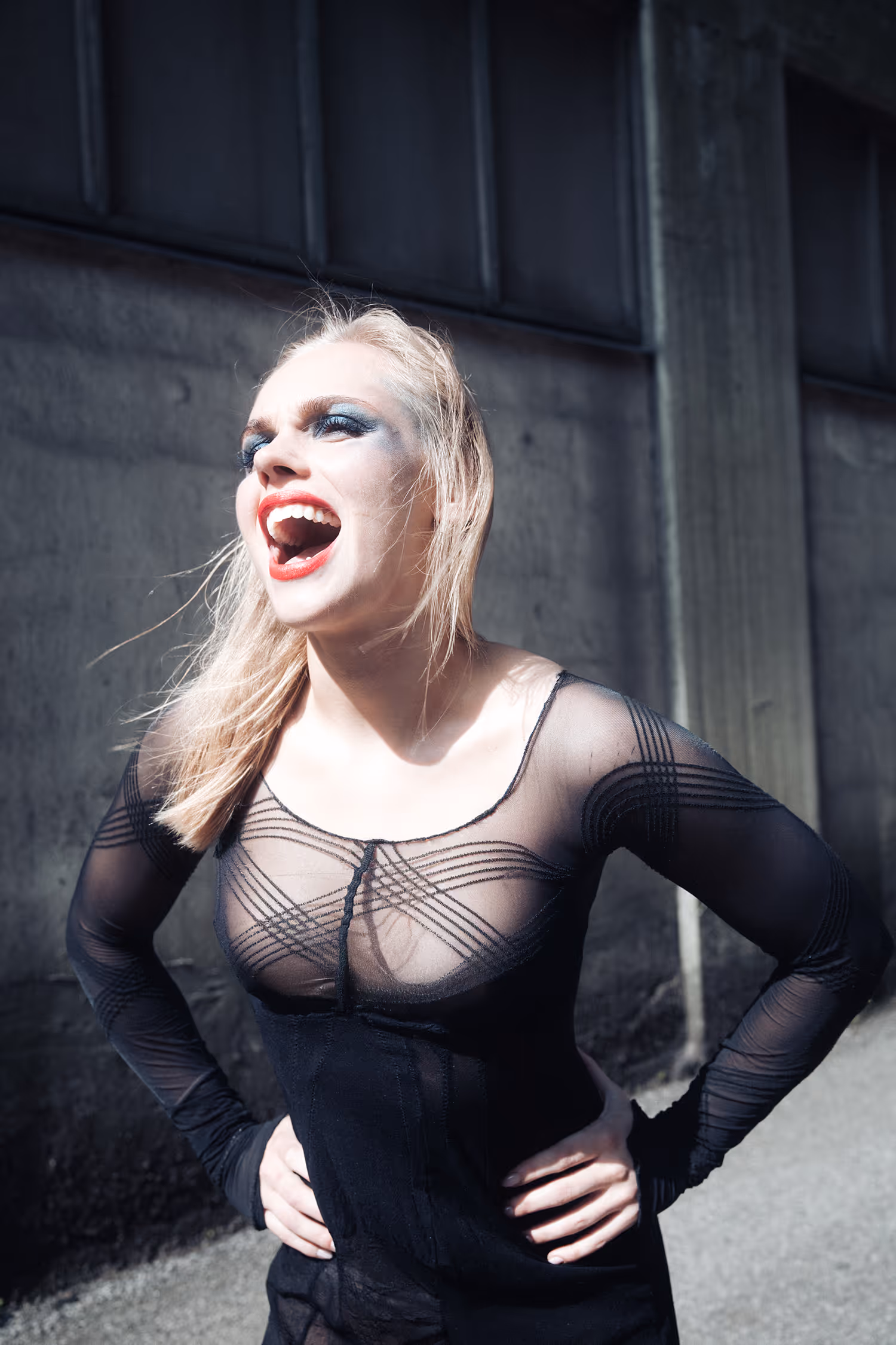 Screaming woman holding her hips