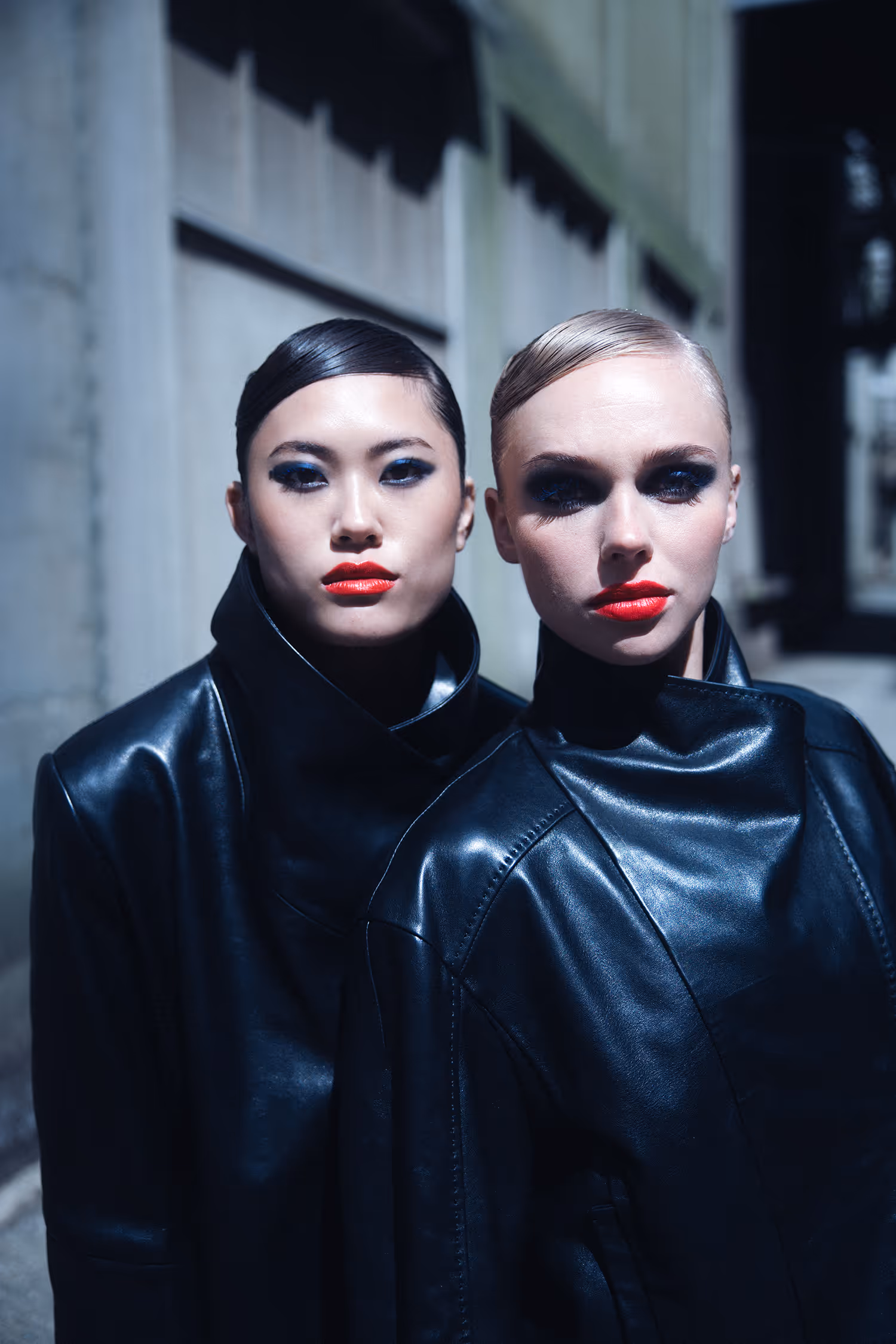 Two women in a sensual pose looking straight ahead